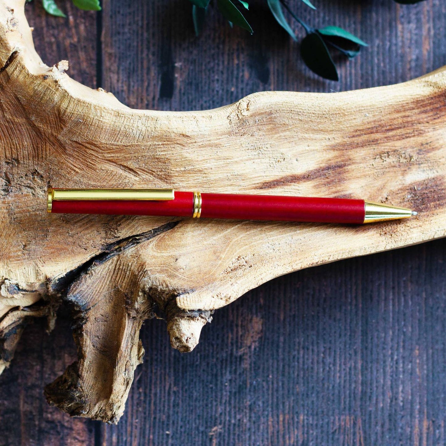 Elegant Vermillion Wooden Pen. Slender, light wood ballpoint pen