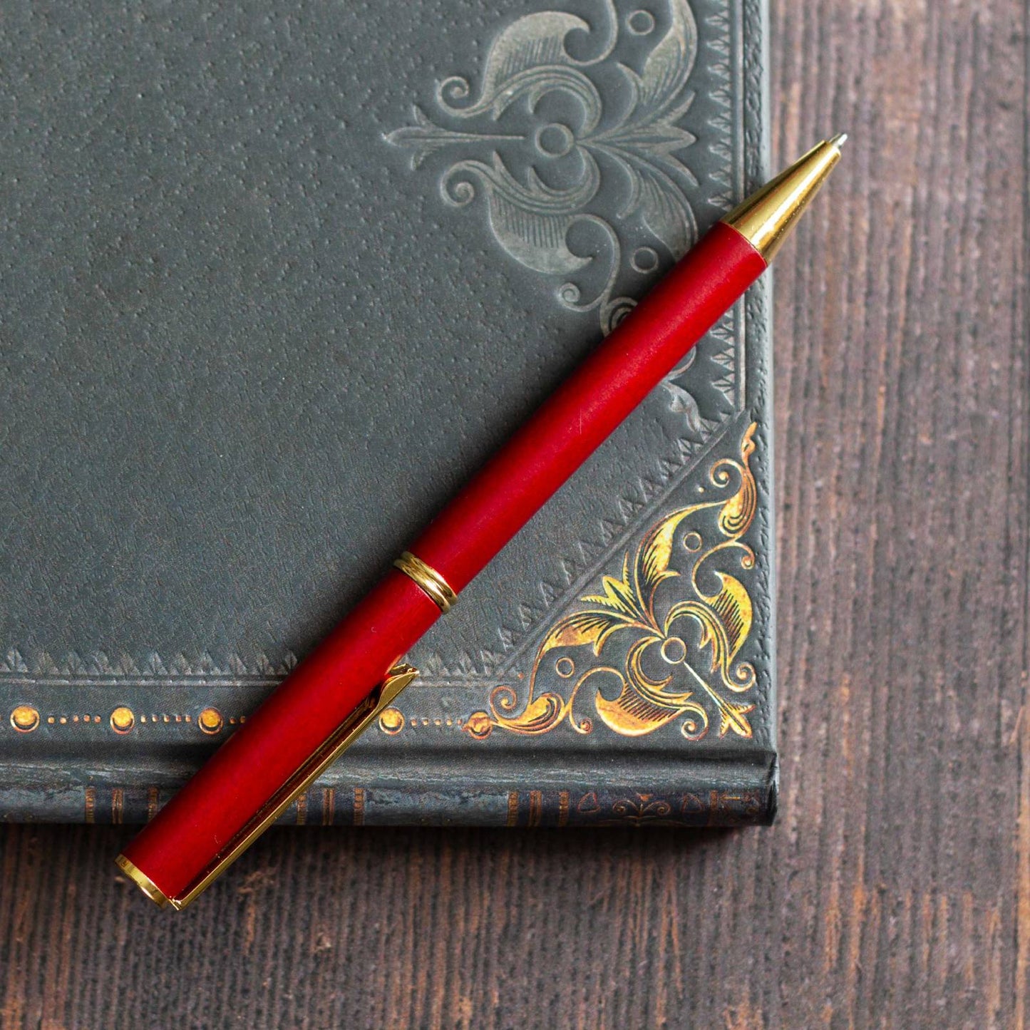 Elegant Vermillion Wooden Pen. Slender, light wood ballpoint pen