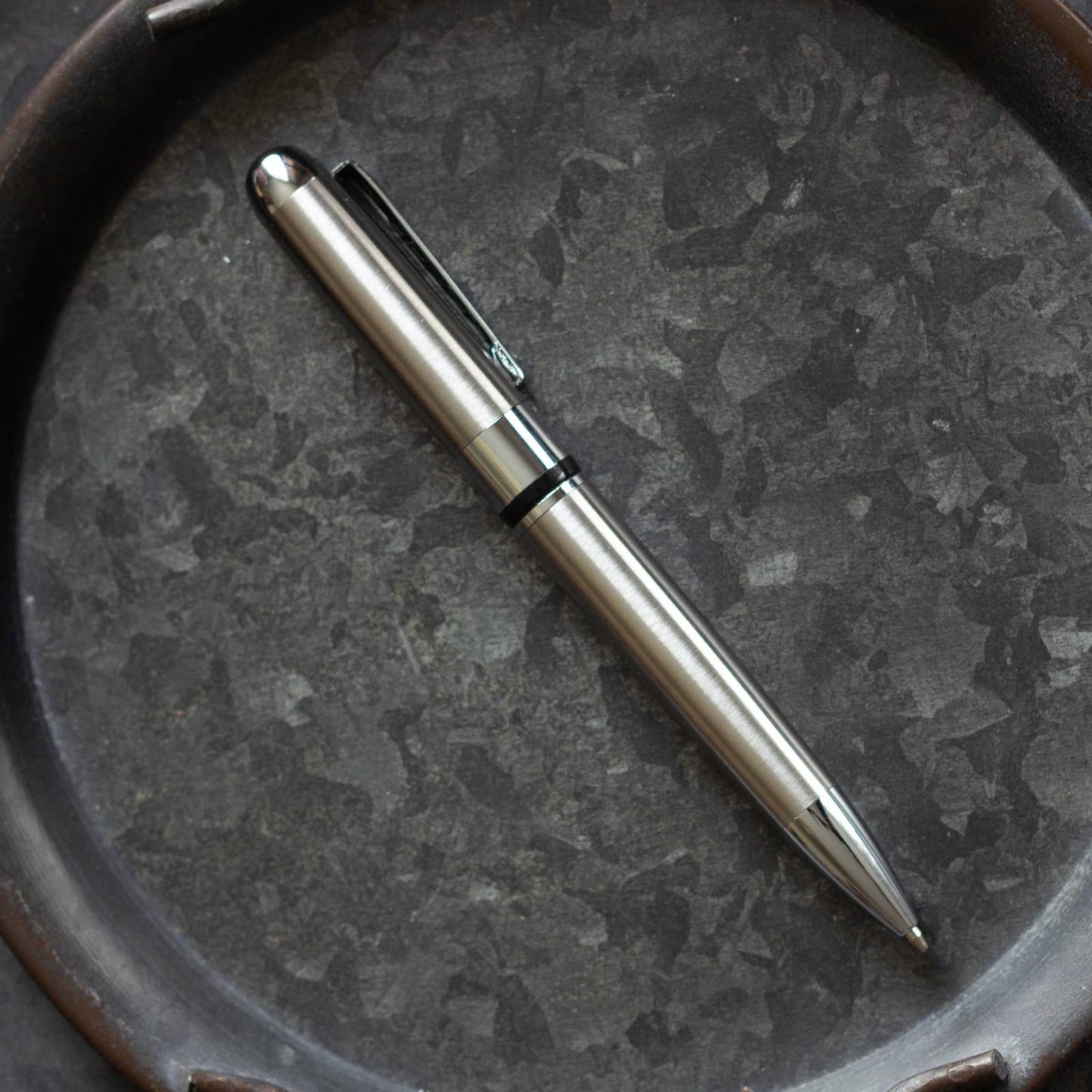 Textured Metal Executive Pen. Black ink, ballpoint pen, twist action.