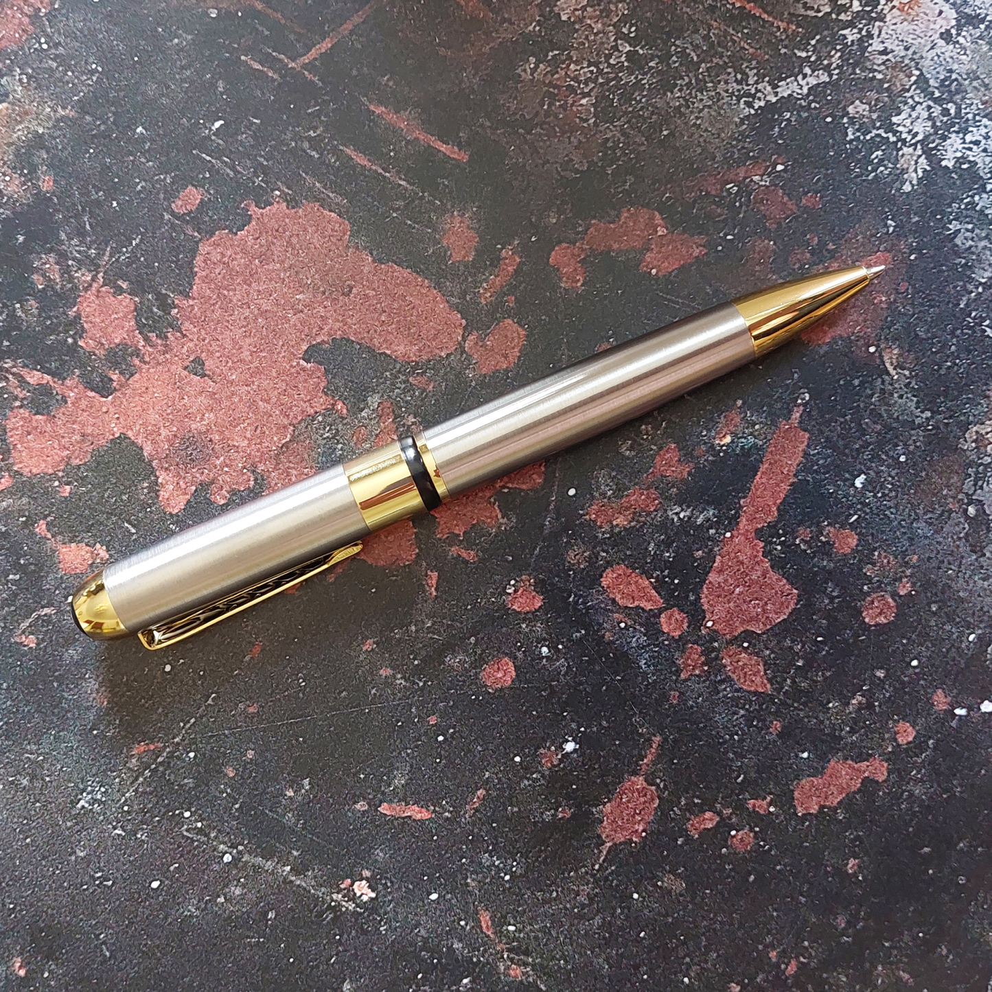 Textured Metal Executive Pen. Black ink, ballpoint pen, twist action.